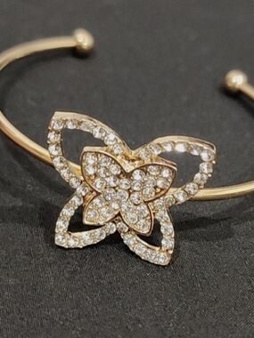 Bangle Cuff gold-toned finish and a butterfly motif adorned Bracelet